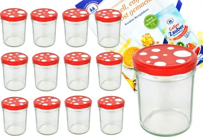 A set of glass jars with red and white mushroom-shaped lids, along with a package of jelly powder.