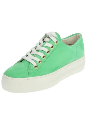 A single green sneaker with white laces and a white sole is shown against a white background.