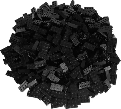 A pile of black LEGO bricks on a white background.