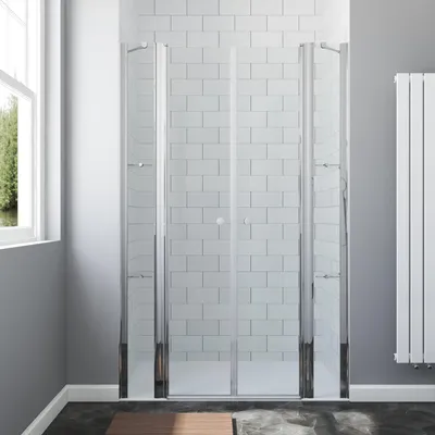 A modern bathroom with a glass shower enclosure.