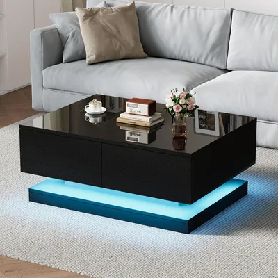 A modern living room scene featuring a black coffee table with LED lighting.