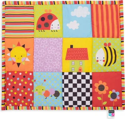 A colorful quilted playmat with various cartoon images and patterns.