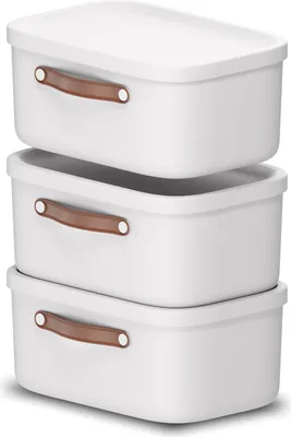 Three white storage boxes stacked on top of each other.