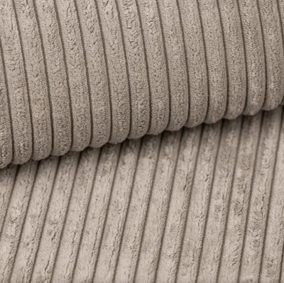 A close-up view of beige corduroy fabric.