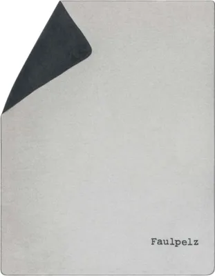 A folded blanket with one corner turned over, revealing a different color on the underside. The brand name 'Faulpelz' is visible in the bottom right corner.