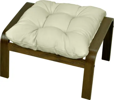 A cream-colored cushion on a dark wood ottoman.