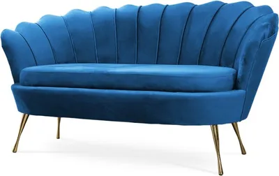 A blue velvet sofa with gold legs is shown against a white background.