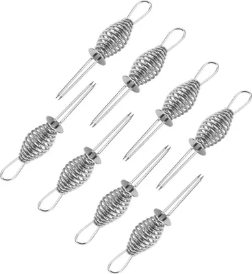 A set of eight stainless steel corn cob holders.