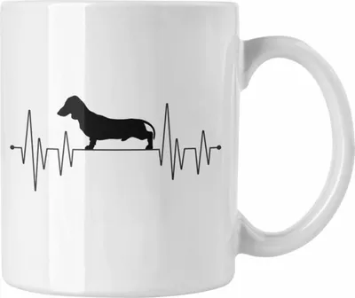 Produktbild von Trendation - Dackel Mom Grafik Tasse Geschenk für Dackel-Besiterin Frauchen Geschenkidee Kaffee-Becher Lustig Herzschlag (Weiß)