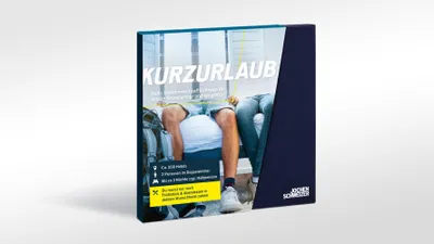 A gift box for a short vacation experience, with text and images on the front.