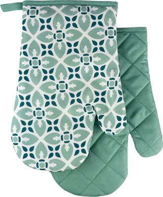 A pair of oven mitts with a geometric pattern.