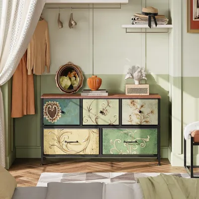 A dresser with decorative drawers in a room setting.