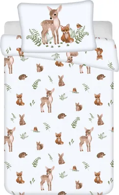 A flat lay of a baby bedding set with a woodland animal theme.