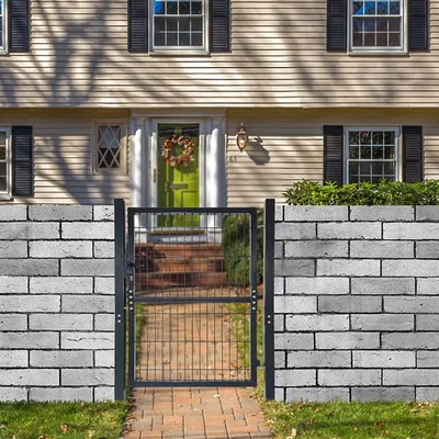 A garden gate in front of a house.