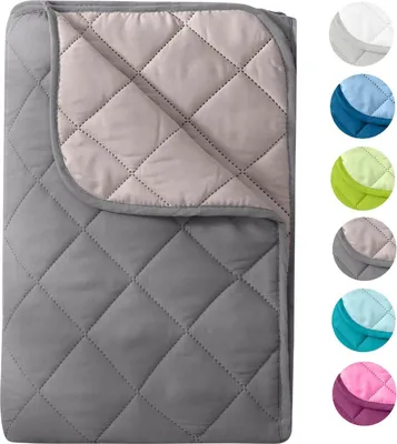 A quilted blanket folded and displayed on a white background, with a row of color swatches to the right.