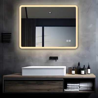 A modern bathroom vanity with a sink and a lighted mirror above it.