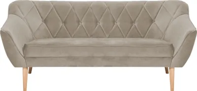 A studio shot of a beige fabric sofa.