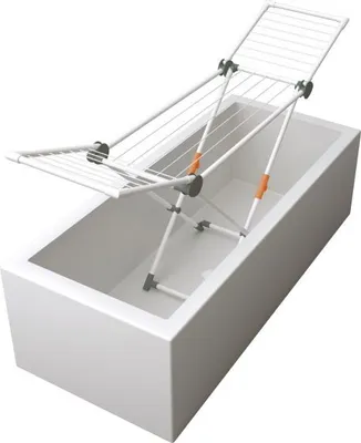 A white drying rack is placed inside a white bathtub.