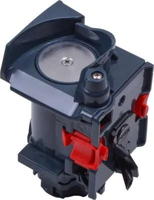 A close-up, angled view of a coffee machine brewing unit.