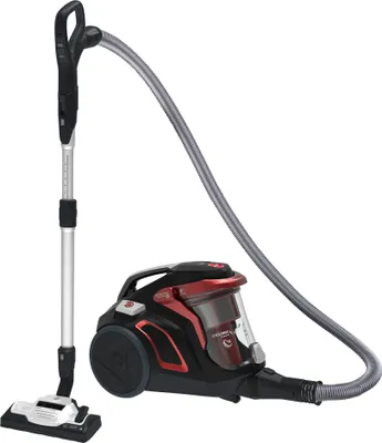 A black and red canister vacuum cleaner with its hose and wand attached, shown against a white background.
