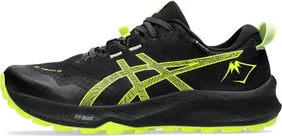 A side view of a black and yellow ASICS trail running shoe.