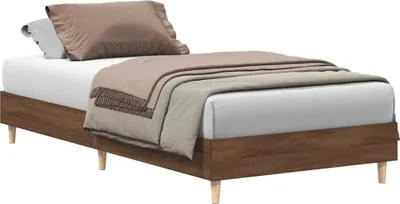 A bed frame with bedding, photographed against a white background.