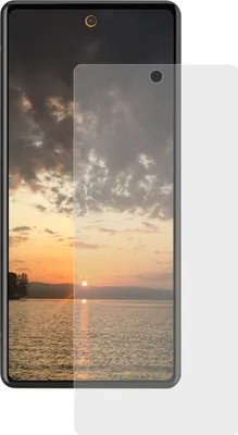A screen protector is placed over a smartphone displaying a sunset.