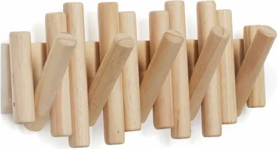 A wooden coat rack with multiple hooks.