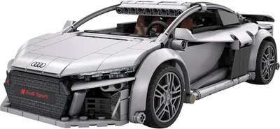 A silver Lego model of an Audi R8 sportscar is shown from a 3/4 front-side angle against a white background.