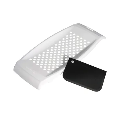 A white Spätzle maker with a black dough scraper on a white background.