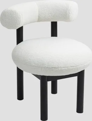 A white, textured chair with black legs against a gray background.