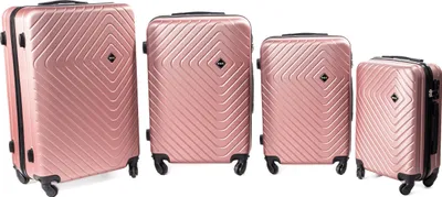 Four rose gold suitcases of varying sizes are displayed side-by-side against a white background.