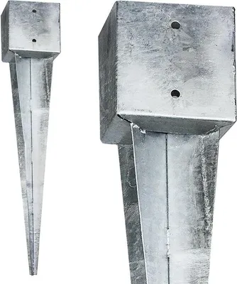 Two galvanized steel ground spikes are shown against a white background. One spike is shown in full, while the other is a close-up of the top section.