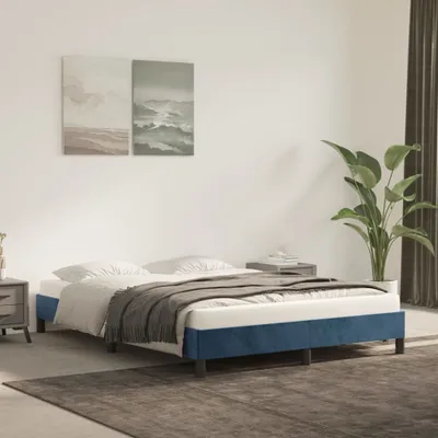 A bedroom scene with a blue bed frame and white bedding.