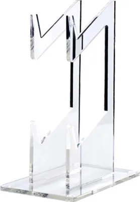 A clear acrylic stand for holding game controllers or phones.