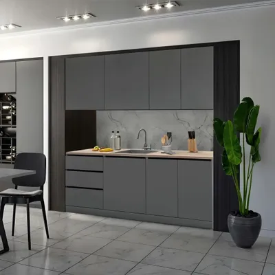A modern kitchen setup with dark gray cabinets and a marble-effect backsplash.