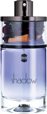 A perfume bottle with a clear glass body containing dried flowers and spices, and a purple liquid.