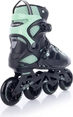 A pair of black and green inline skates on a white background.