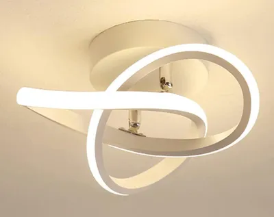 A modern white LED ceiling light fixture with a swirling design, mounted on a white ceiling.