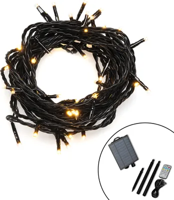 A coiled string of LED lights with a solar panel and accessories in the lower right corner.