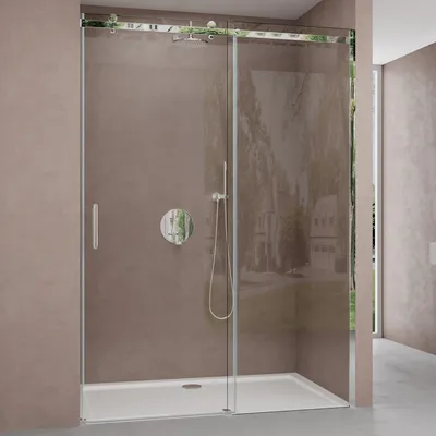 A modern shower enclosure with a sliding door, featuring a shower head and controls, set against a textured wall and a hint of an outdoor scene through the glass.