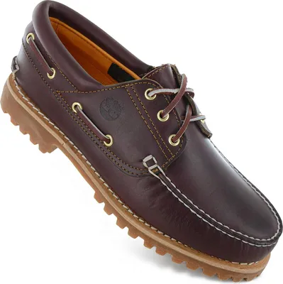 A single brown leather boat shoe is shown against a white background.