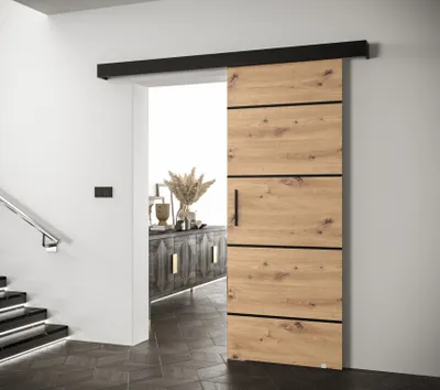 A modern interior hallway with a sliding barn door made of wood and black accents, leading to another room with a console table and decor.