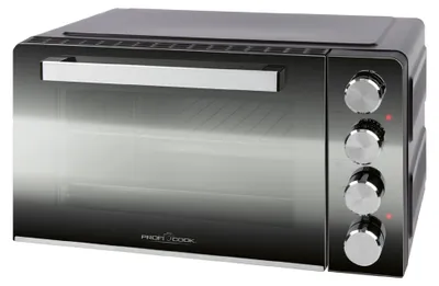 A studio shot of a black and silver mini oven.