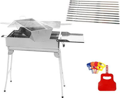 A stainless steel charcoal grill with accessories, including skewers and a shovel, on a white background.
