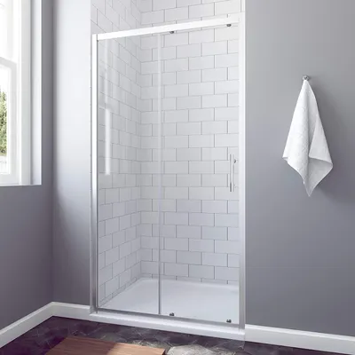 A modern bathroom with a sliding shower door.