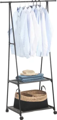 A clothing rack with several shirts hanging and items on shelves below.