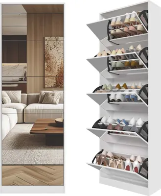 A white shoe cabinet with multiple shelves filled with shoes, placed next to a mirrored panel reflecting a living room scene.