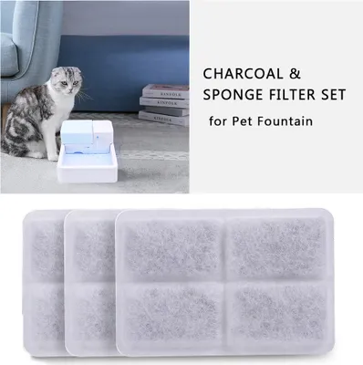 A cat sits next to a pet fountain, with charcoal filters shown below.