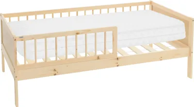 A wooden children's bed with a mattress and a safety rail, shown against a white background.